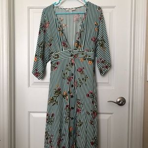 A beautiful knee length dress with a deep v neck.